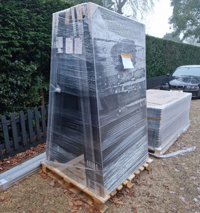 Solar panels stacked on a pallet (Image: Tanjent)
